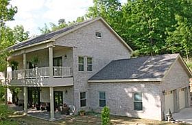 Kodiak Steel Homes Savannah model finished with brick walls and shingle roof